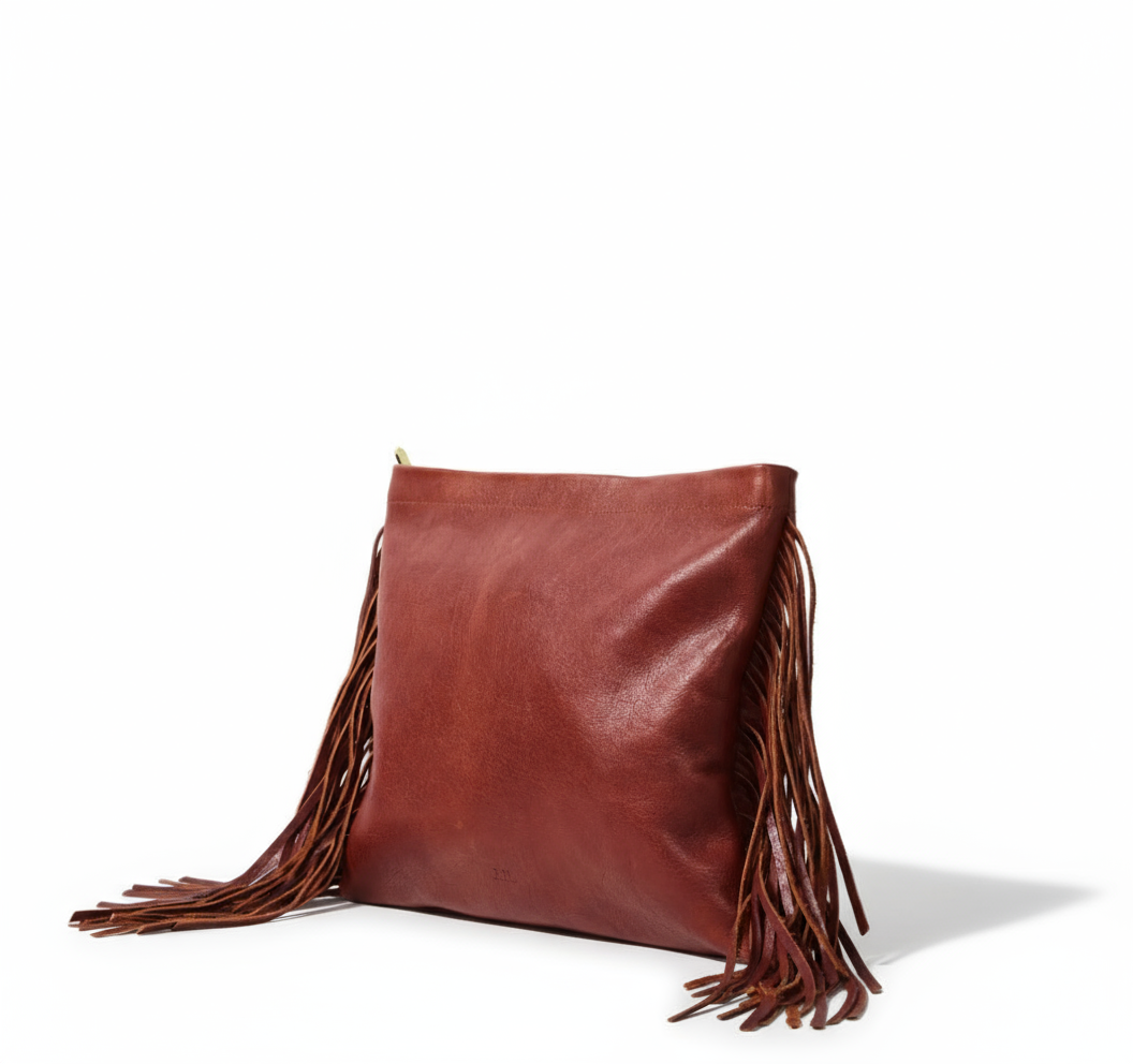 Brown leather clutch bag with fringe created from sustainably sourced materials