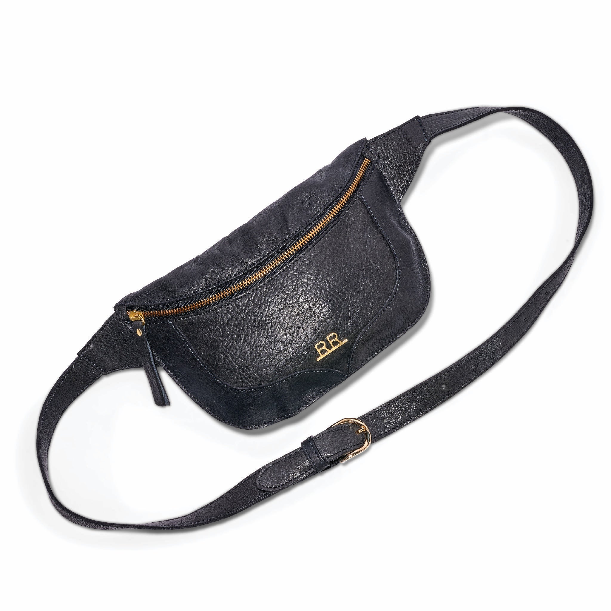 Slim crossbody belt bag with adjustable strap and signature brass hardware