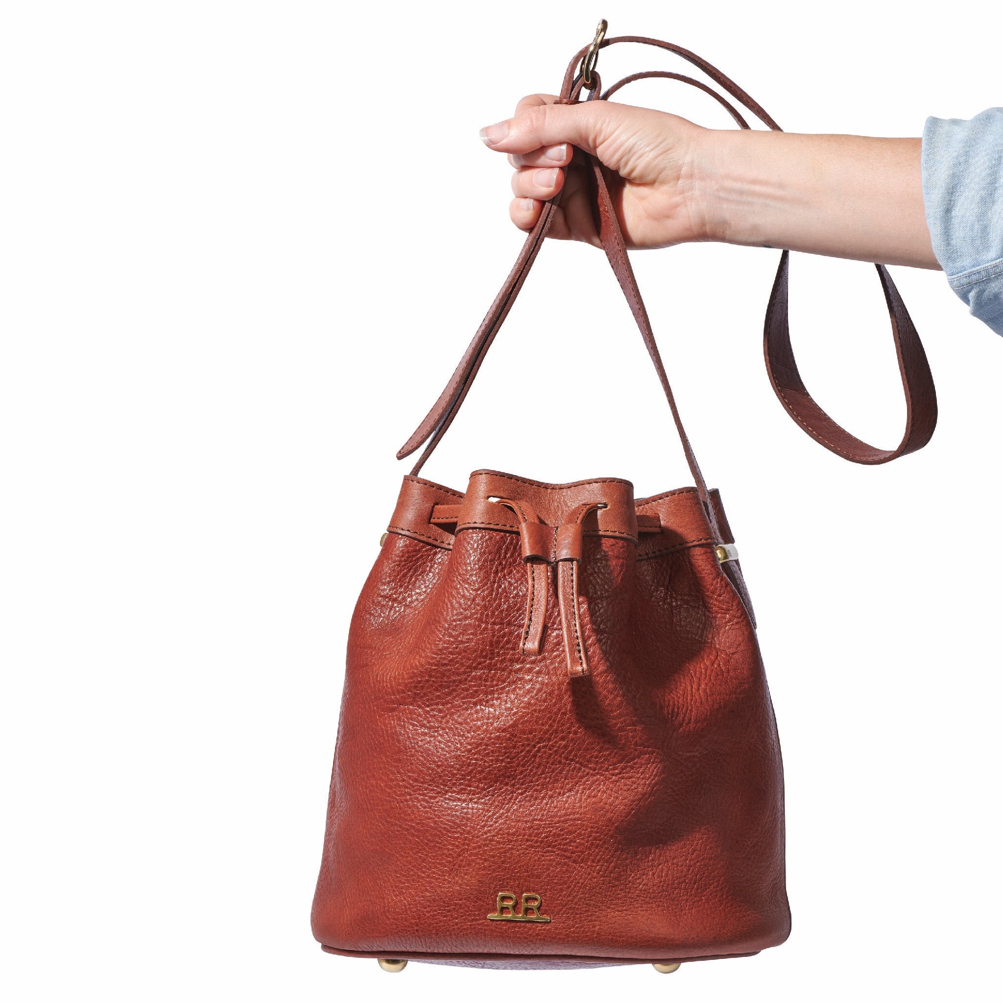 Mahogany brown leather bucket bag with lined interior and secure inner pocket