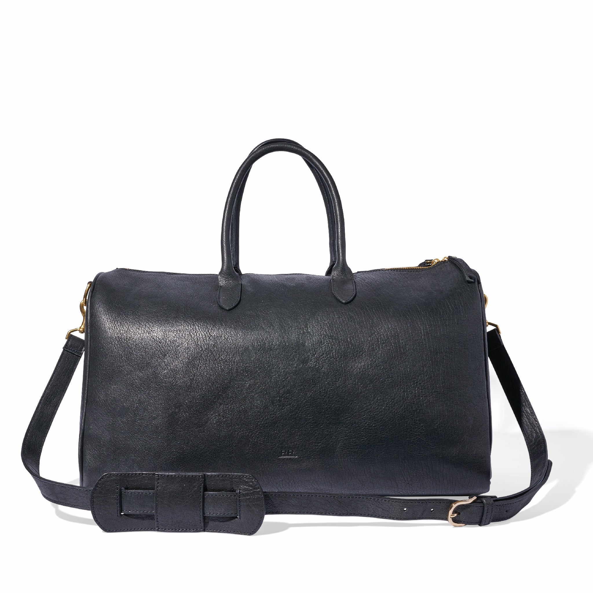 Leather duffle bag with brass feet, structured base, and shoulder strap