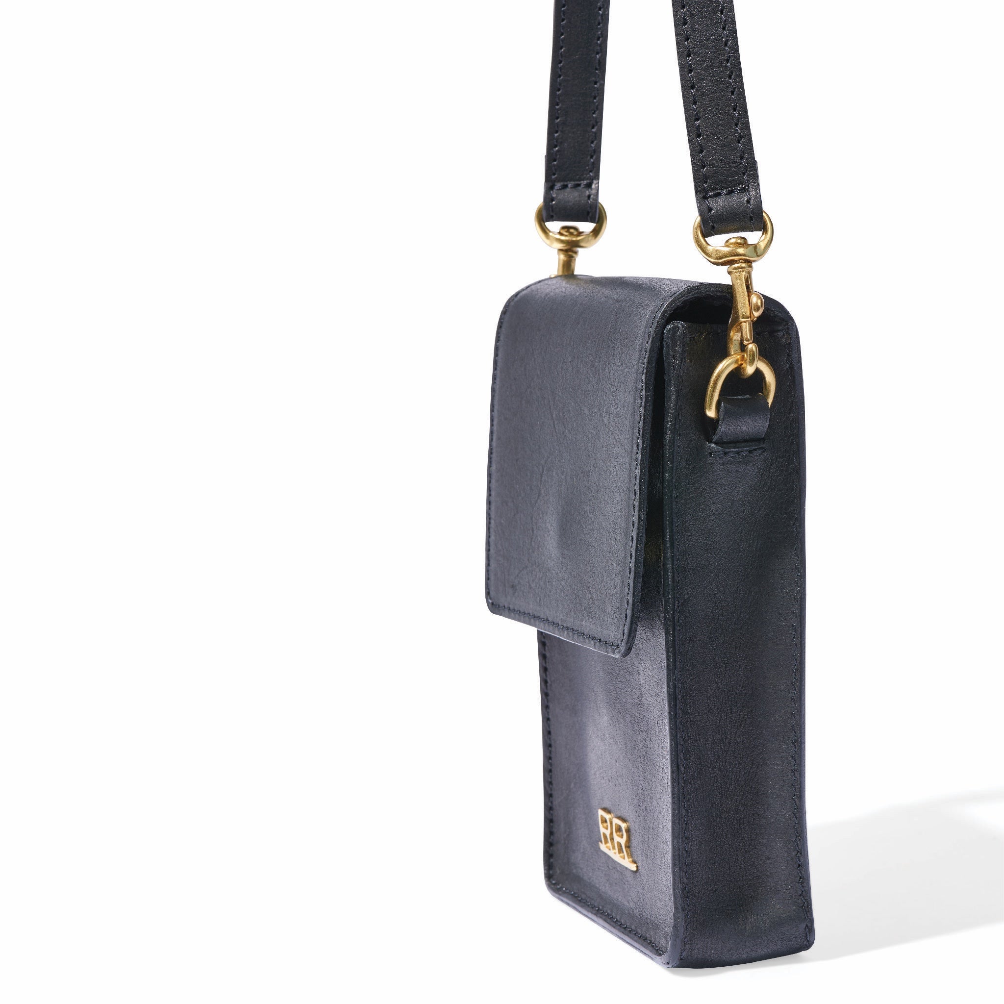 Crossbody leather phone bag with adjustable strap and structured silhouette