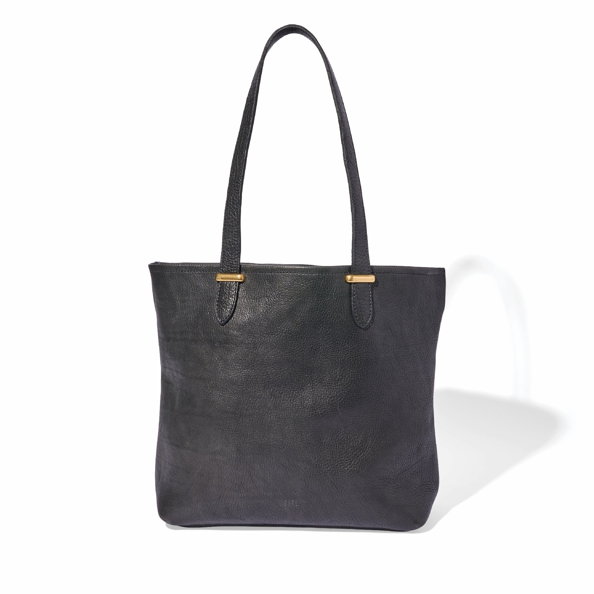 Spacious black tote bag with brass hardware and crossbody strap