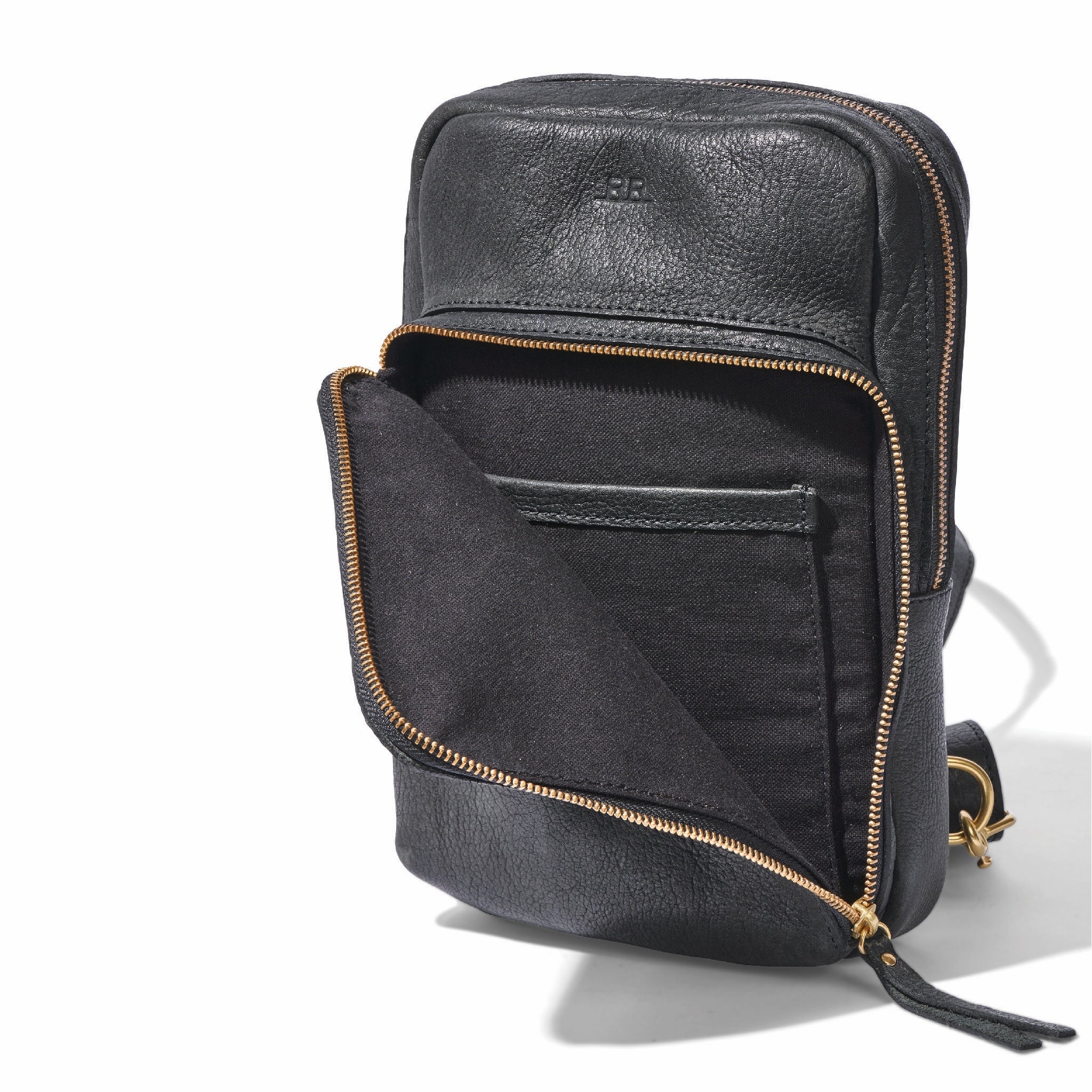 Black Sling Bag styled as waist pack, handcrafted from regenerative leather