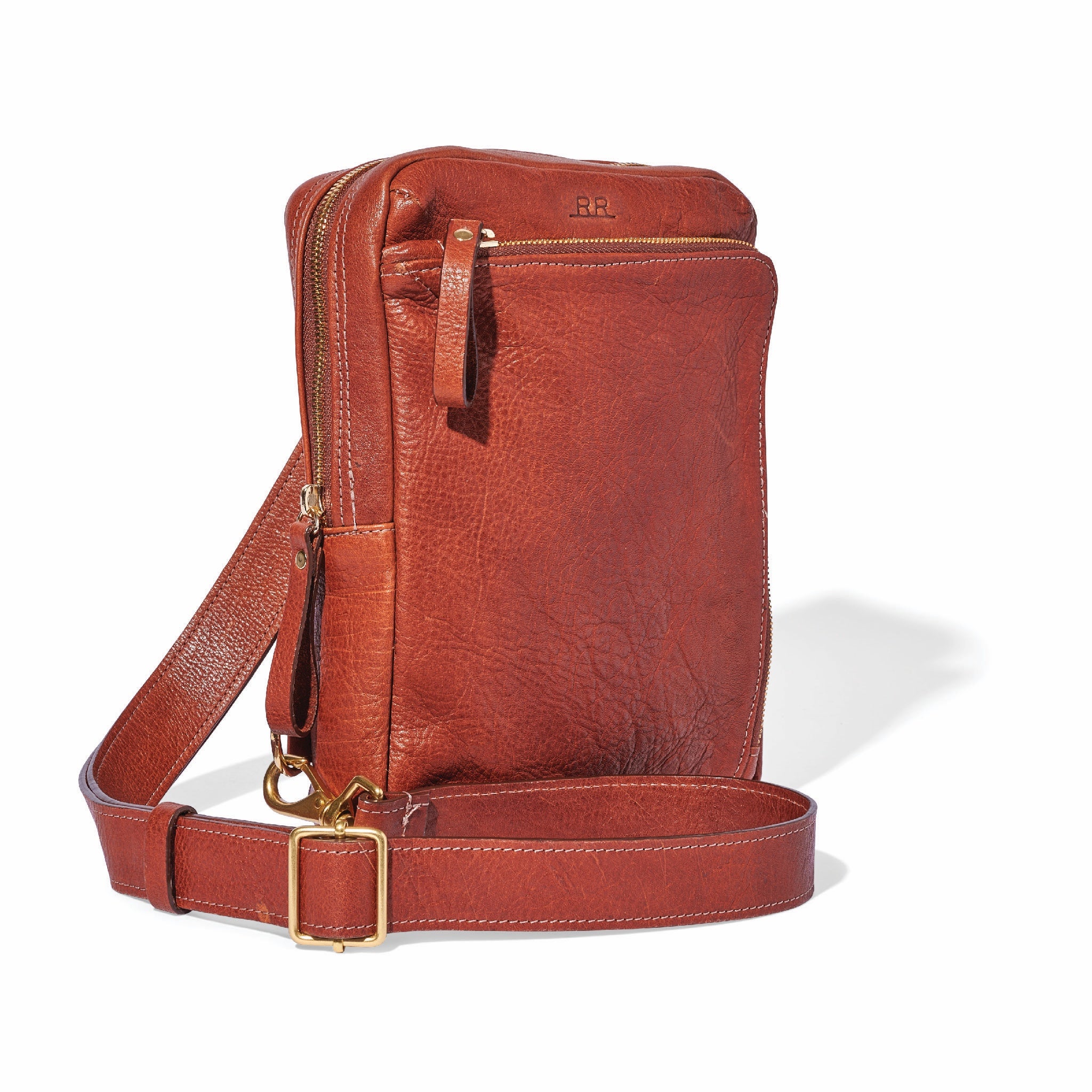 Adjustable leather sling bag with versatile wear options and lined interior