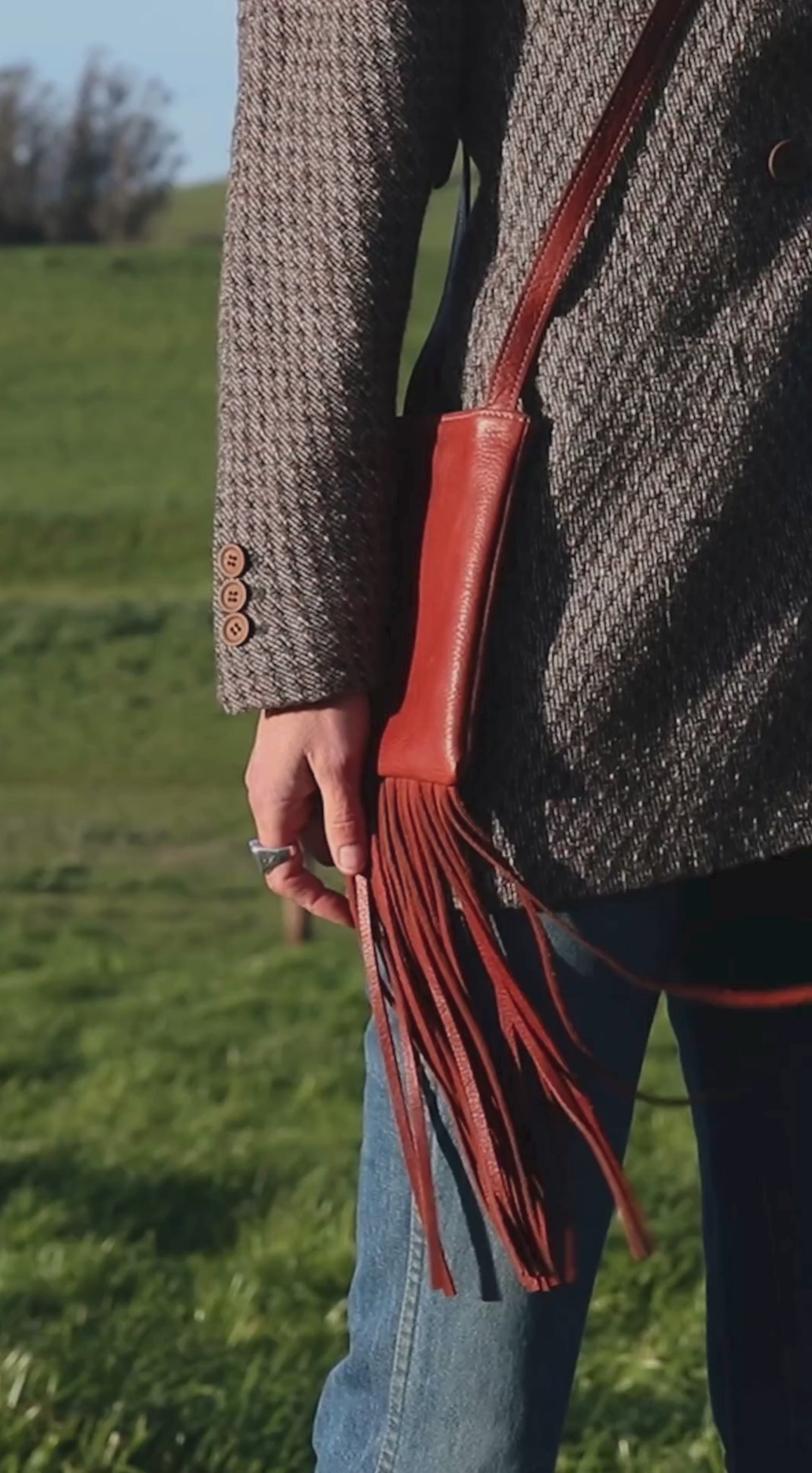 nterior view of Fringe Phone Bag with lined pocket and secure flap