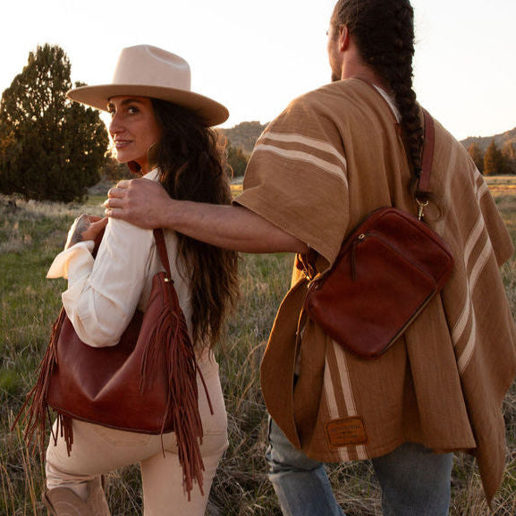 two people wearing ethical fashion brands and carrying sustainably made leather handbags