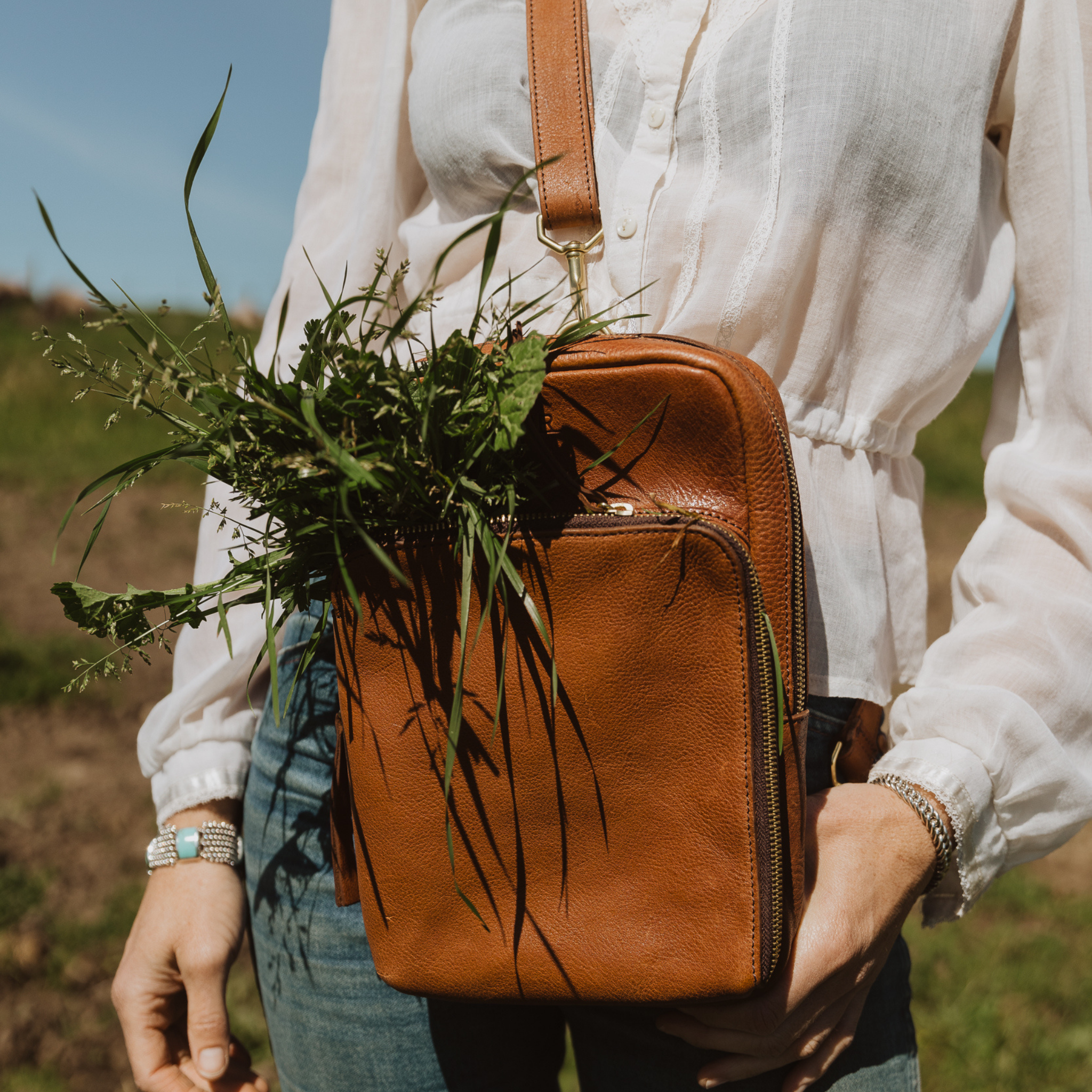 Side view of Range Revolution Sling Bag with zip pocket and soft structure